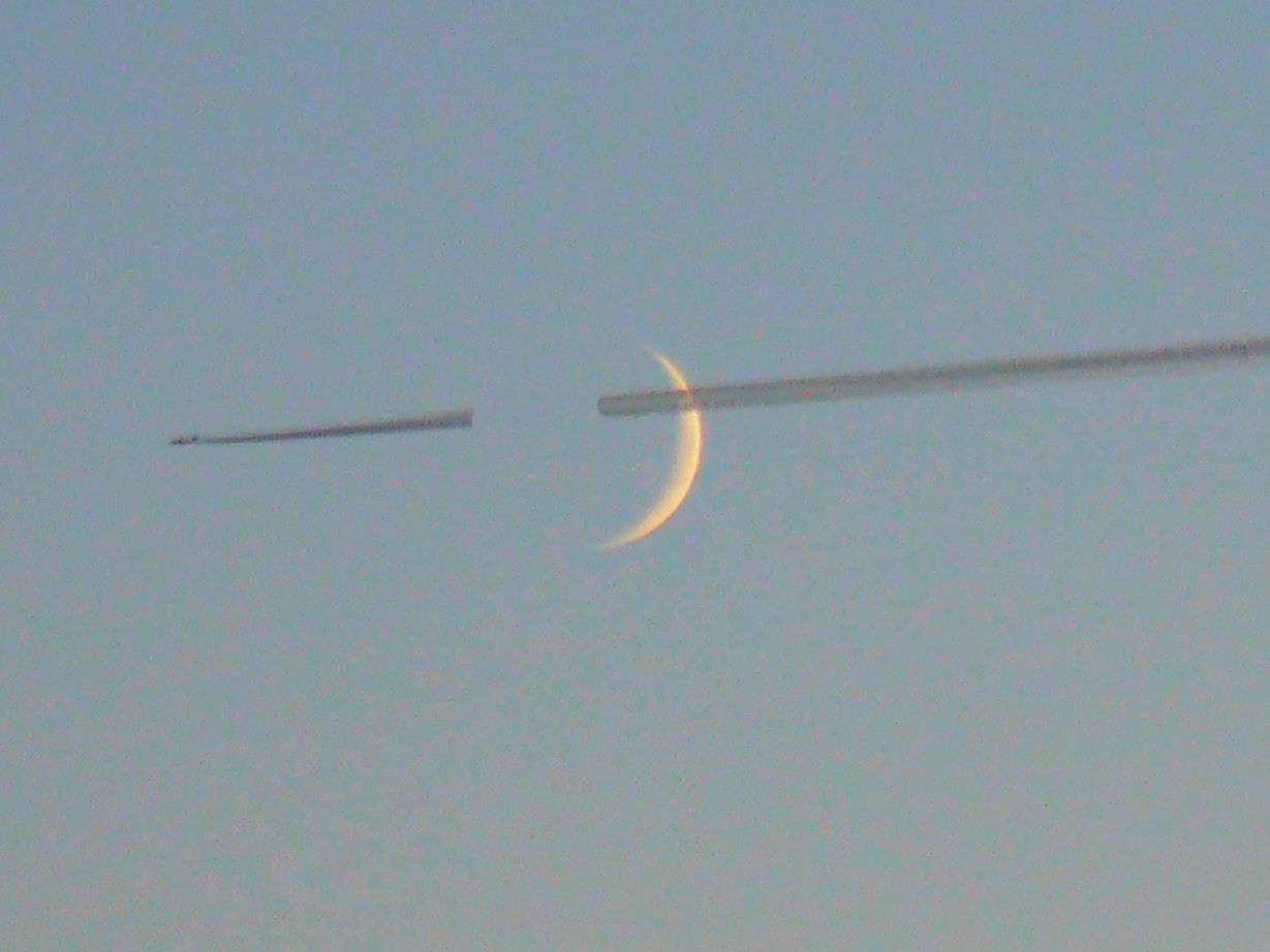 The wake of an airplane crosses the moon: 62 KB